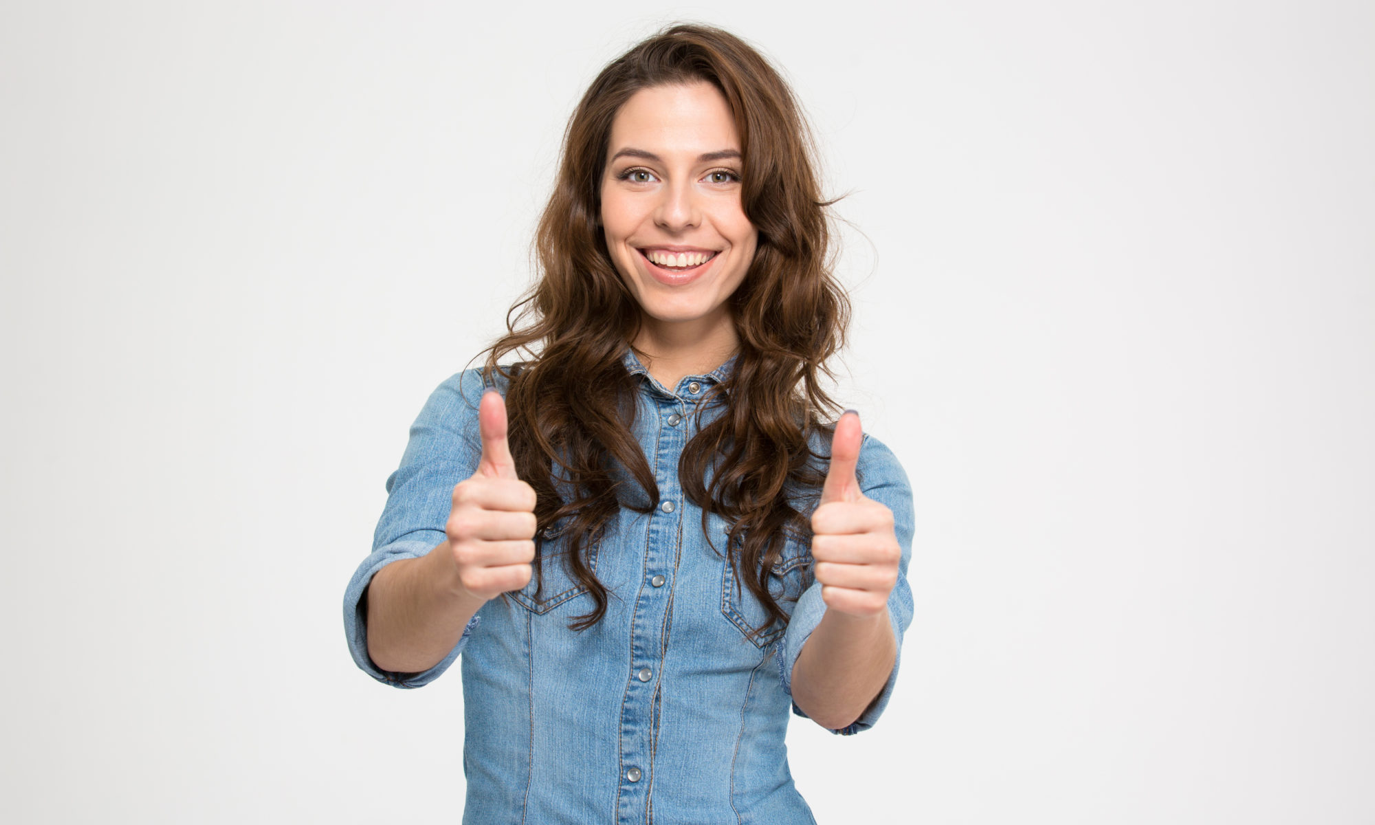 excited woman with two thumbs up